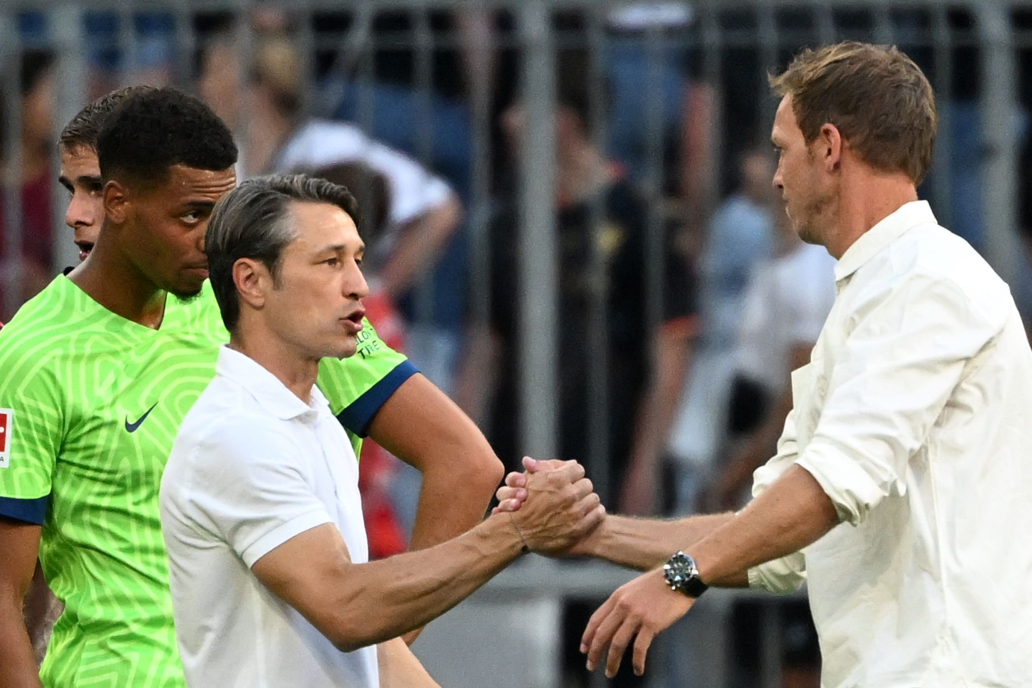 Wolfsburgs Trainer Niko Kovac (l) Und Münchens Cheftrainer Julian Nagelsmann Verabschieden Sich Nach Dem Spiel Voneinander.